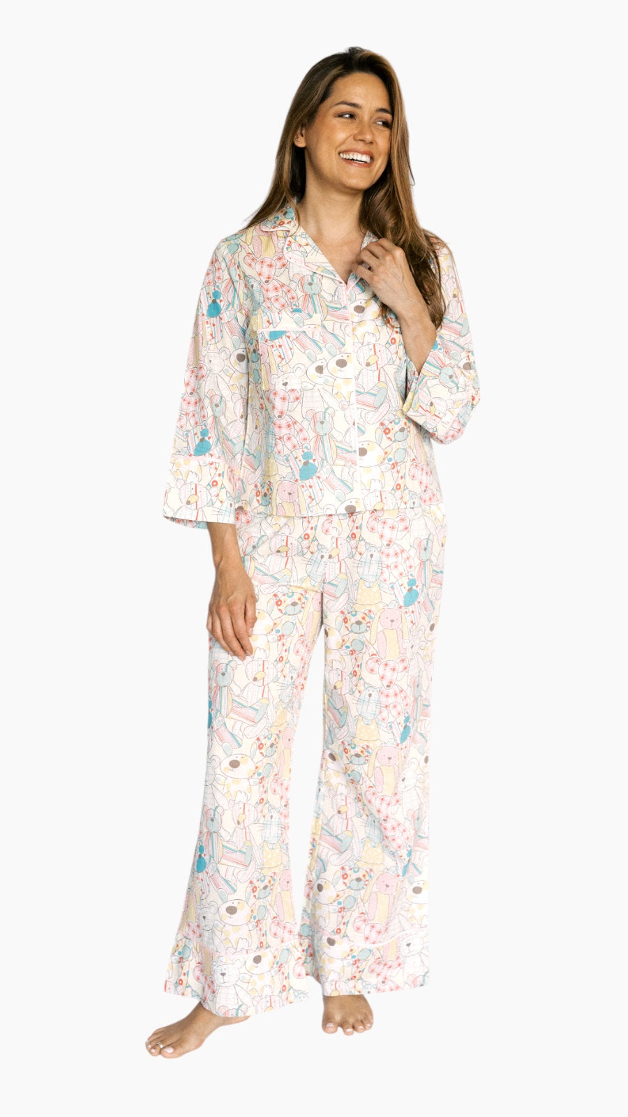Woman wearing a floral pajama set on a white background