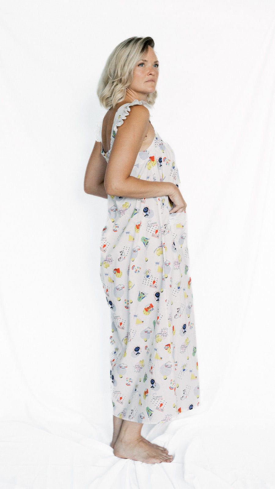 Woman wearing a patterned nightgown on a white background
