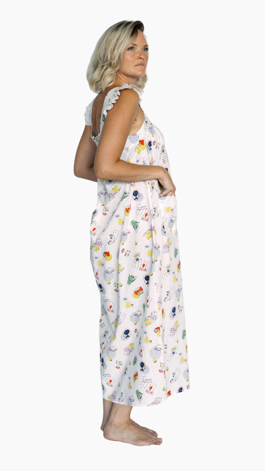 Woman wearing good vibes nightgown on a white background