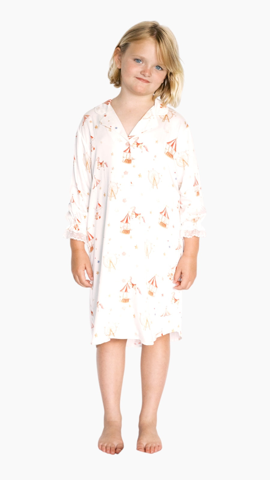 Young girl wearing carnival print nightgown on a white background